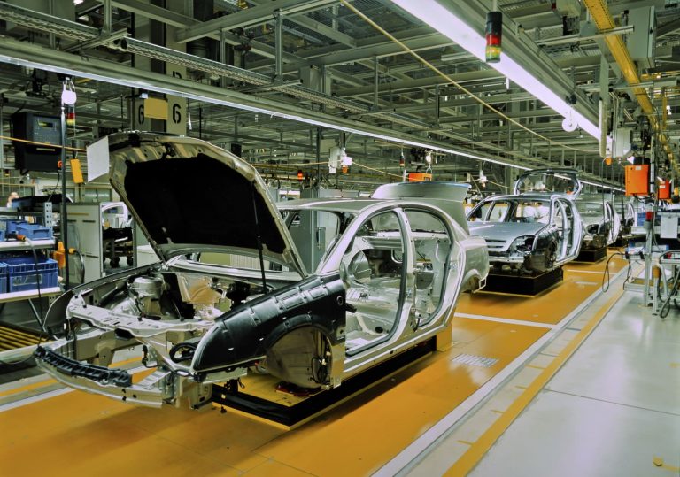 Car bodies on an automotive assembly line in a modern factory