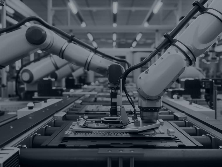 Robotic arms working on an automated production line
