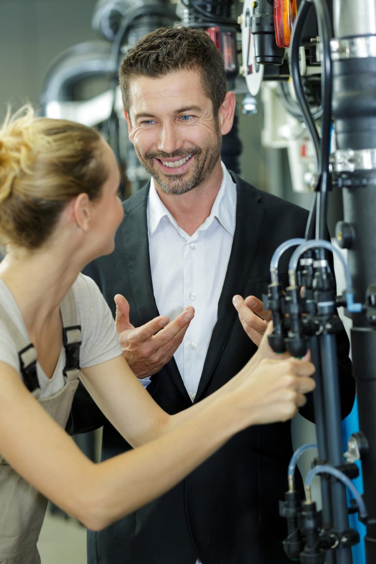 Two colleagues talking in a workshop