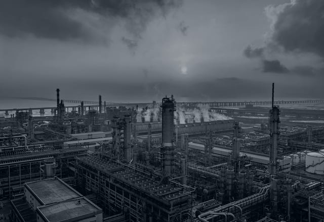 Chemical refinery at sunset