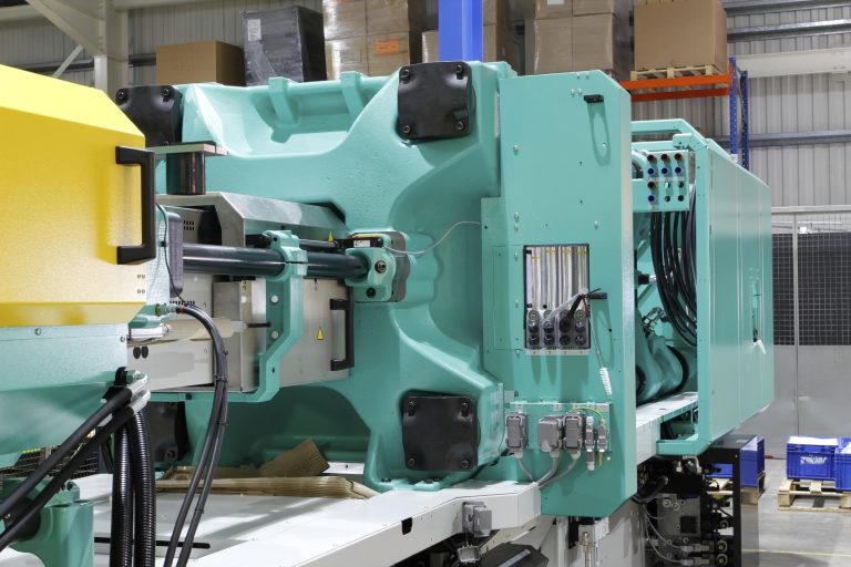 Modern injection moulding machine in a clean, well-lit factory