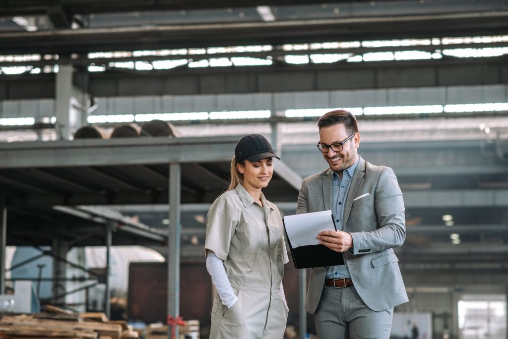 Supervisor and worker reviewing a checklist on the shop floor