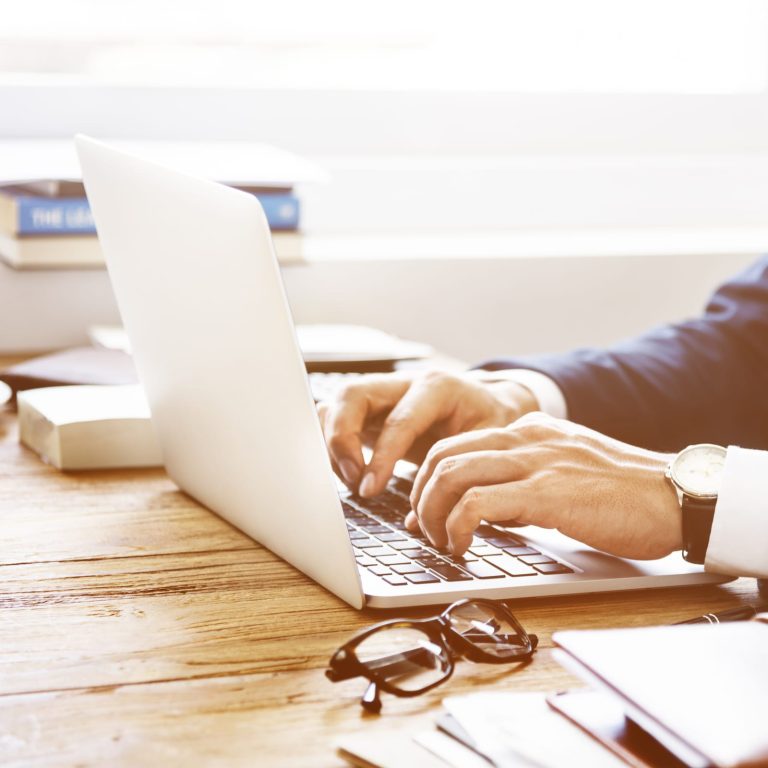 Typing on a laptop