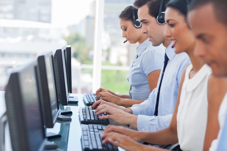 Call centre staff on headsets